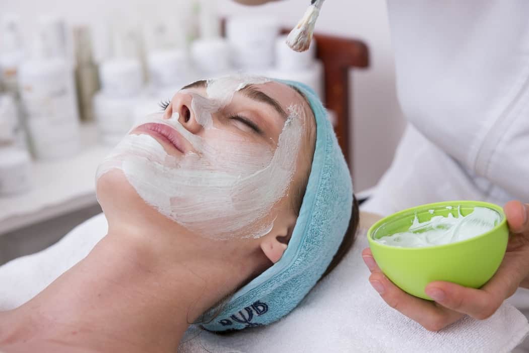 woman having facial spa treatment